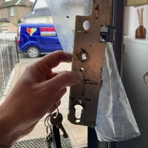 Locksmith in Edinburgh replacing a multipoint locking system.