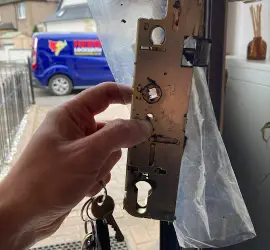 Locksmith in Edinburgh replacing a multipoint locking system.